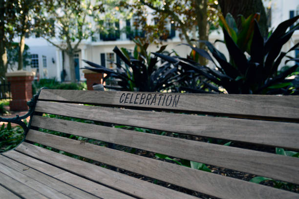 wooden park bench in celebration, fl - celebration imagens e fotografias de stock