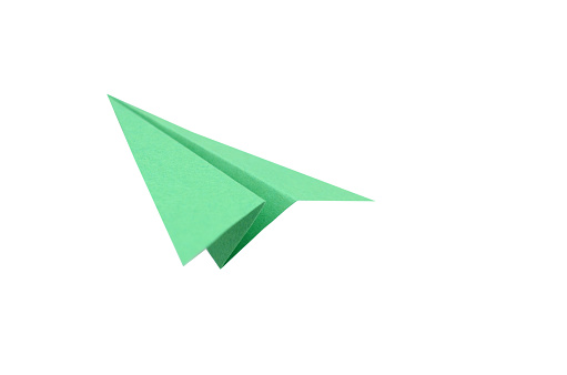 green paper plane departure on white