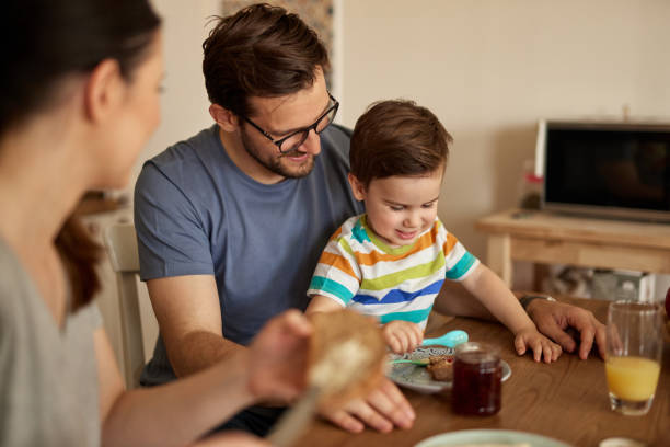 istock Parents spending some quality time with their adorable son at breakfast time 1446038761