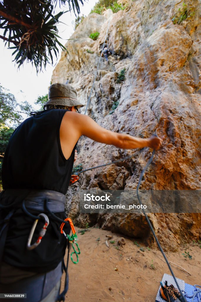 Teamwork Enjoys Climbing Challenges Stock Photo - Download Image Now ...