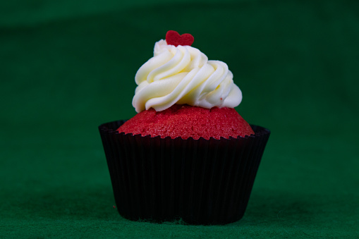 Red velvet cupcake filled with cream cutted cross section