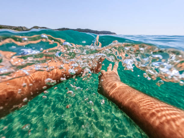 istock Young Man Swimming In The Sea 1446039658