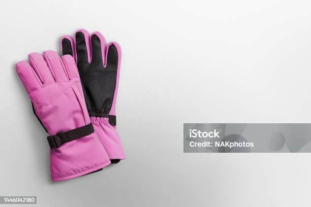 Pink Winter Gloves On A White Background Stock Photo - Download Image Now - Glove, Sports Glove, Protective Glove