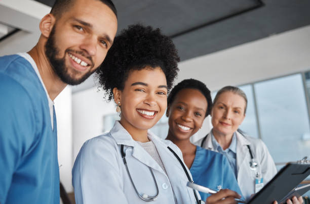 medicine, doctors and healthcare team at work with smile for medical portrait, diversity and teamwork in canada hospital. trust, collaboration or cardiology with nurse, worker or clinic employees - portrait doctor paramedic professional occupation imagens e fotografias de stock