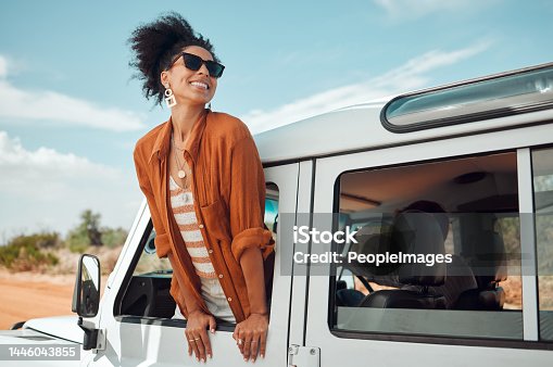 istock Black woman on road, enjoying window view of desert and traveling in jeep on holiday road trip of South Africa. Travel adventure drive, happy summer vacation and explore freedom of nature in the sun 1446043855