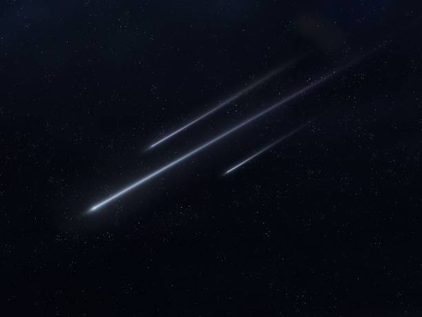 istock Meteors glow in the night sky. Falling stars. 1446044185
