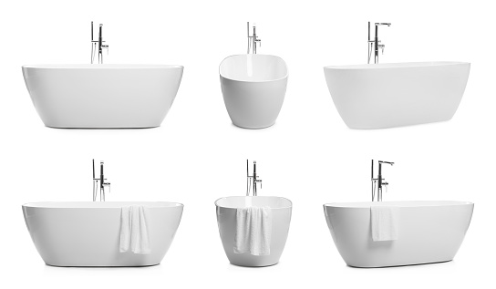 Set with stylish ceramic bathtubs on white background