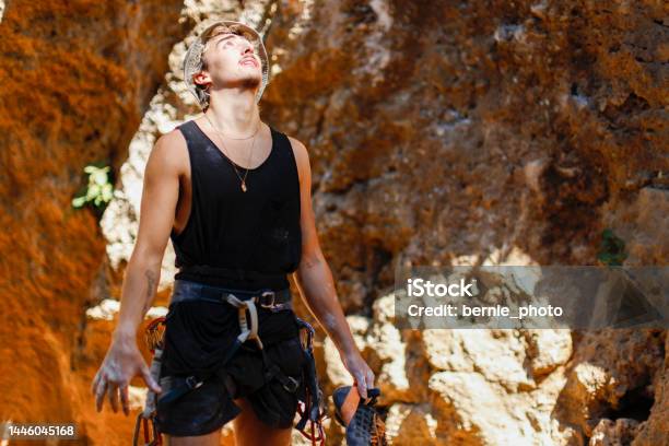 Rock Climber Stretching Fingers To Release Muscle Stress Stock Photo - Download Image Now