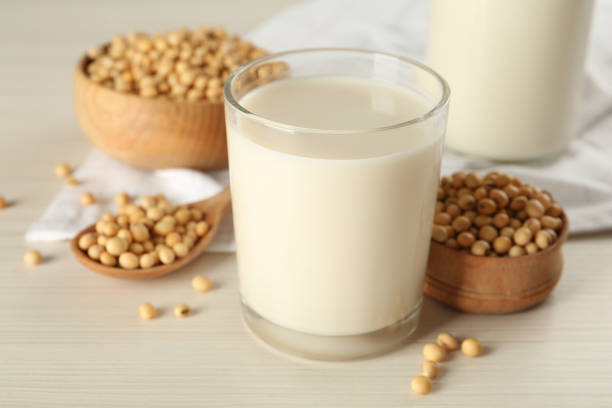 istock Fresh soy milk and beans on wooden table, closeup 1446046260