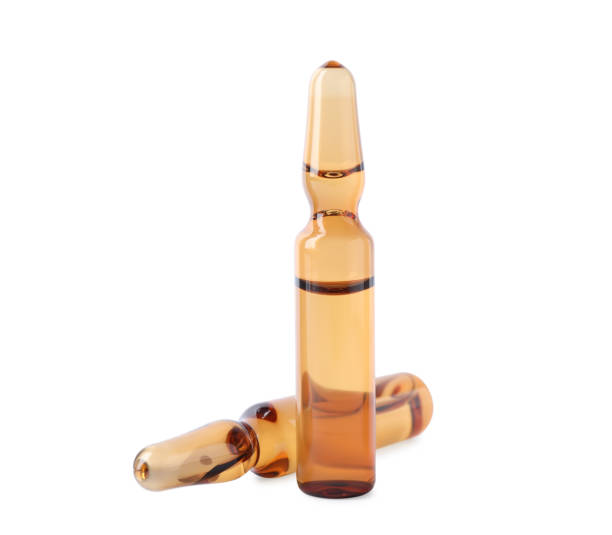istock Brown pharmaceutical ampoules with medication on white background 1446046416