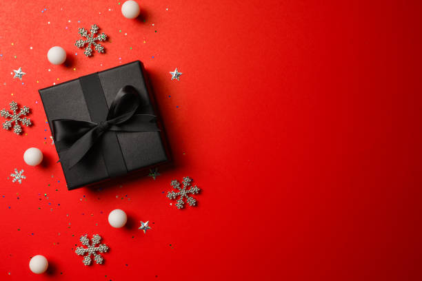 istock gift box background, red background and black gift box. Gift box on red background 1446046463