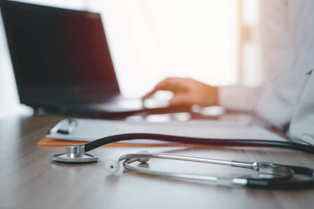 istock Specialized doctors are working with laptop to print patient information or are analyzing the cause of pathogens, Concept of medical treatment Health care, public health, prevention of virus. 1446046819
