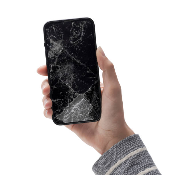 istock Woman holding a smartphone with cracked screen 1446047118