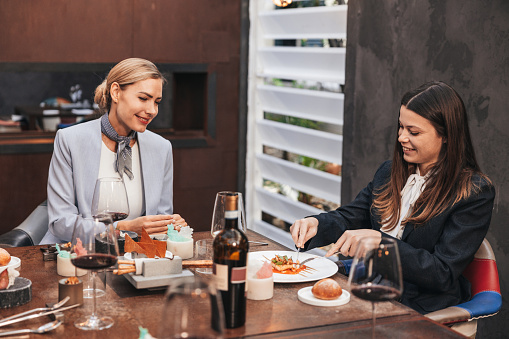 Furious senior couple having problems in their relationship while arguing in a restaurant.