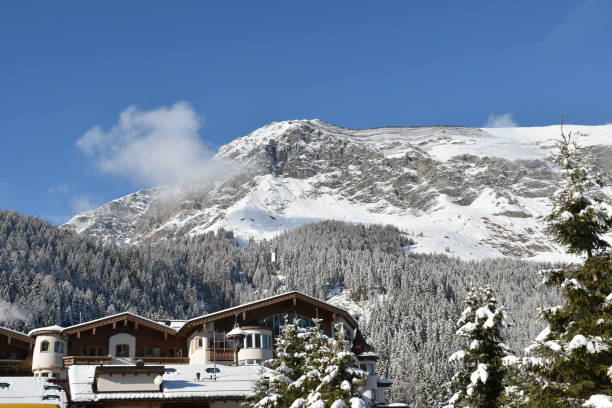 istock Alpine styled hotel on a sunny day with a rocky mountain behind 1446048739