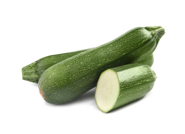istock Whole and cut ripe zucchinis on white background 1446050137