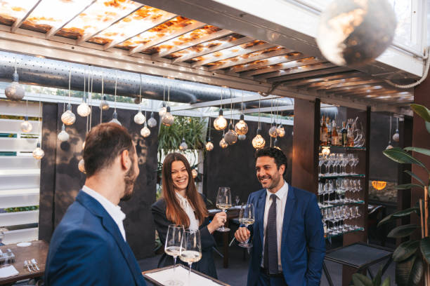 istock Waiter serves welcome drink to business guests 1446050302
