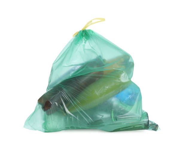 istock Full green garbage bag isolated on white. Rubbish recycling 1446051624