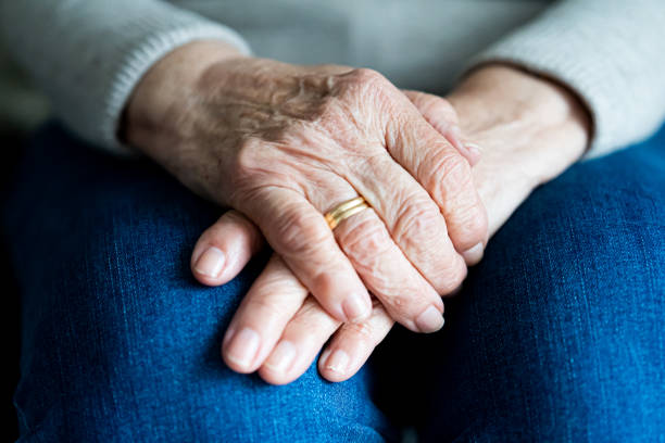 istock Hands of an elderly widow close up 1446051737