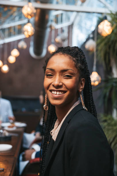 istock Happy young woman smiling at camera 1446053412