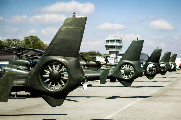 Military airport with a group of army helicopters.