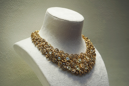 Expensive golden necklace with diamond in a jewelry store.