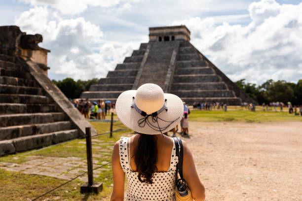 istock Tourist visiting Chichen Itza pyramid in Mexico 1446067952
