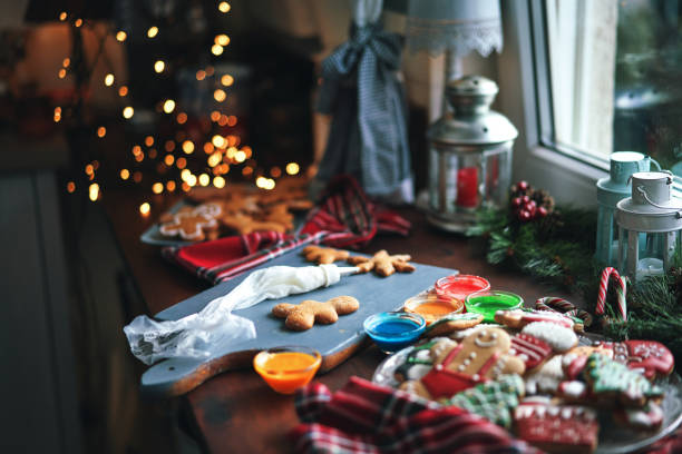 istock Decorating Gingerbread Christmas Cookies with Icing 1446068622