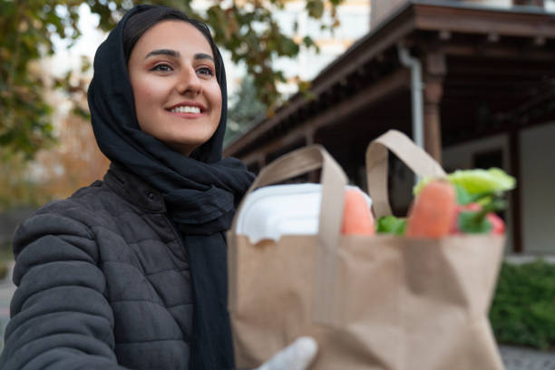 istock Volunteer Delivering Food To Elderly People During Lockdown 1446069881