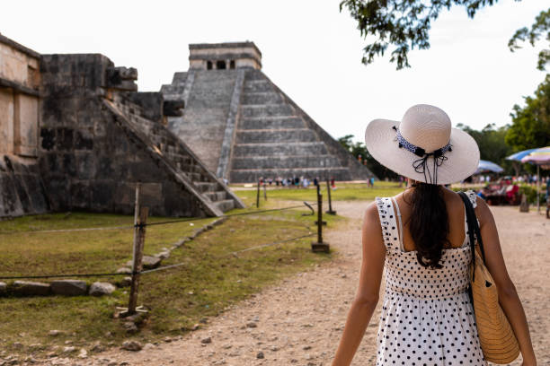 istock Tourist visiting Chichen Itza pyramid in Mexico 1446070032