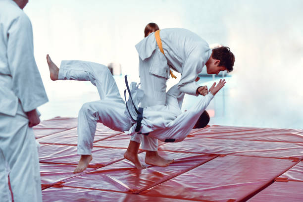 Judokas Practicing Ippon Seoi Nage Throw stock photo