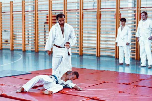 istock Tatami Mats Absorbing Full Force Of Judo Throws During Class 1446071063
