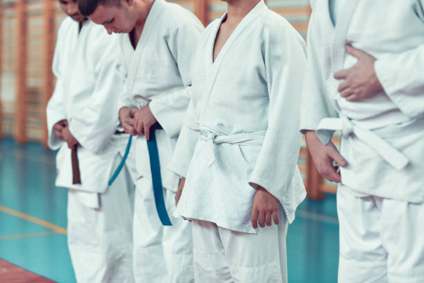 istock Judokas Adjusting Belts And Gis 1446071204