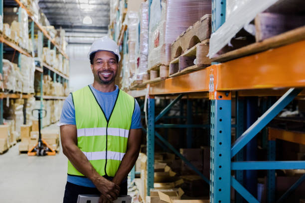 istock Long-time warehouse manager smiles for his headshot 1446073091