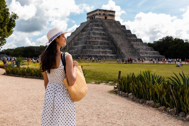istock Tourist visiting Chichen Itza pyramid in Mexico 1446075863