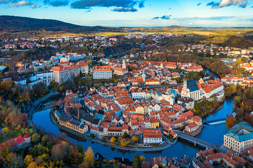 Aerial view of historical centre of Cesky Krumlov town on Vltava riverbank on autumn day overlooking medieval Castle, Czech Republic. View of old town of Cesky Krumlov, South Bohemia, Czech Republic.