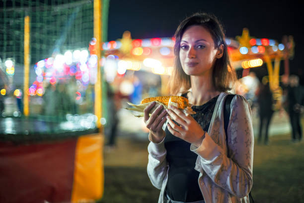 istock Young woman at funfair carnival 1446081597