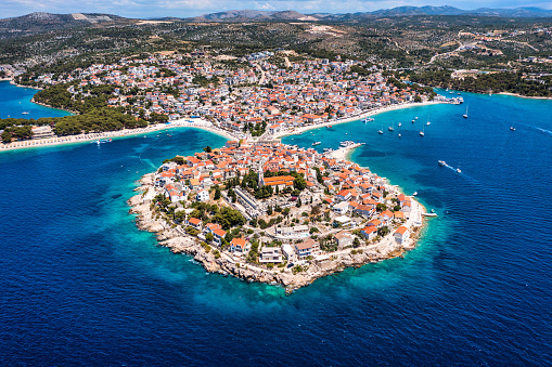 Aerial view of Primosten old town on the islet, Dalmatia, Croatia. Primosten, Sibenik Knin County, Croatia. Resort town on the Adriatic coast. Aerial view of adriatic town Primosten, Croatia