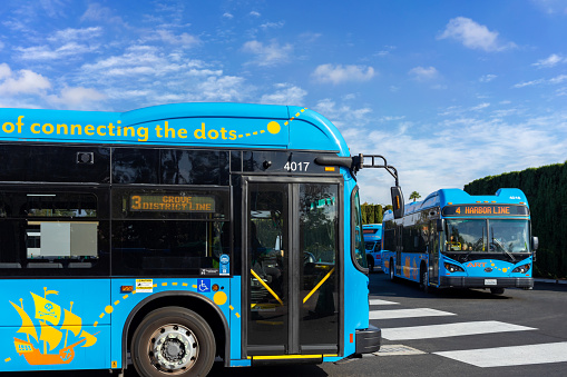 Anaheim, CA, USA – November 1, 2022: Two blue Anaheim Resort Transportation (ART) buses in the bus terminal in Anaheim, California.