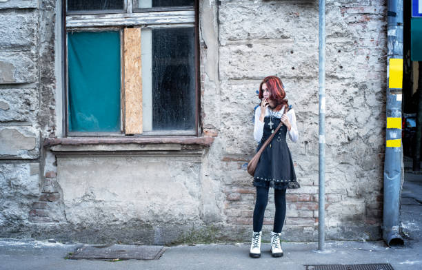 istock Teenager smoking on a sidewalk 1446081912