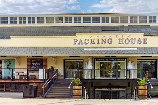 Anaheim, CA, USA – November 2, 2022: Exterior of the historic Sunkist citrus processing and packing plant building, renovated as the Anaheim Packing House located in downtown Anaheim, California.