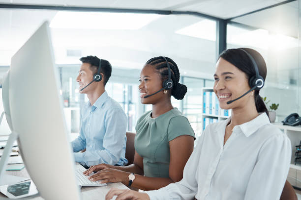 istock Call center, telemarketing or customer support consultants working on computer in a modern office. Diversity, crm and happy employees consulting for ecommerce, sales and customer service with tech. 1446083227