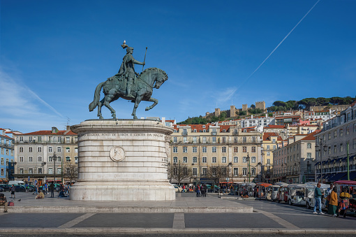 Lisbon, Portugal - Feb 14, 2020: Praca da Figueira Square with King Dom Joao I Statue and Saint George Castle (Castelo de Sao Jorge) on background - Lisbon, Portugal