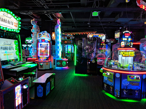 Honolulu - March 26, 2018: Arcade Games including Grand Piano Keys, Zombie Snatcher, Luigi Mansion, and Sonic at Lucky Strike Social on Oahu, Hawaii.