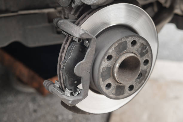 istock New brake pads or lining being installed in calipers of modern p 1446085775