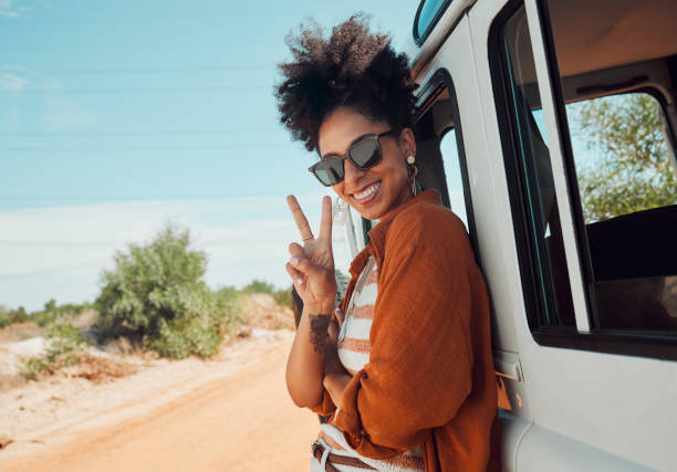 Travel, van and woman with peace hand sign on road trip in Mexico, happy, relax and smile. Summer, nature and journey in a countryside with a black woman excited about adventure and hipster lifestyle Travel, van and woman with peace hand sign on road trip in Mexico, happy, relax and smile. Summer, nature and journey in a countryside with a black woman excited about adventure and hipster lifestyle v sign stock pictures, royalty-free photos & images