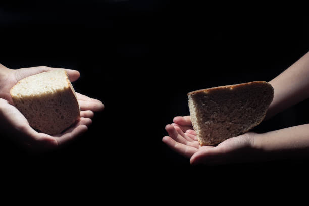 istock outstretched hands of children with bread 1446088780