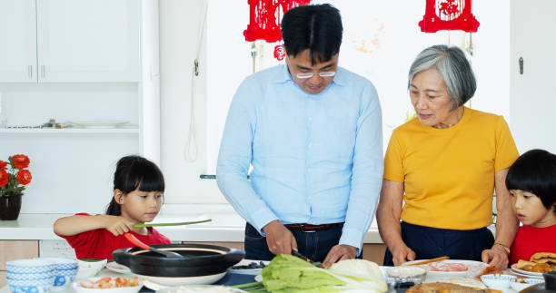 istock Little Girl Fetching Bowl for Dad in Kitchen 1446090315