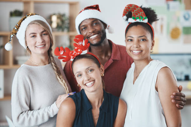 istock Office team, Christmas party and celebration with a smile at work. Diversity, workers and happy business people celebrating holiday together at party, festive group or financial year at the company 1446090399