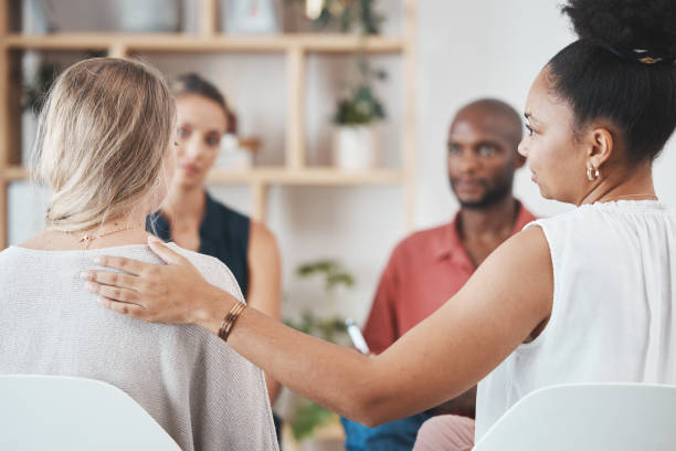 istock Support, help and group of people in therapy discussion for mental health problem, stress or depression with professional psychologist or therapist. Care, trust and psychology with community talking 1446091713